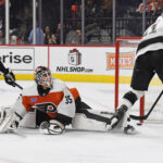 Dec 19, 2024; Philadelphia, Pennsylvania, USA; Los Angeles Kings center Anze Kopitar (11) scores a goal past Philadelphia Flyers goaltender Aleksei Kolosov (35) and defenseman Travis Sanheim (6) during the second period at Wells Fargo Center. Mandatory Credit: Eric Hartline-Imagn Images
