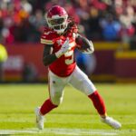 Dec 21, 2024; Kansas City, Missouri, USA; Kansas City Chiefs wide receiver Hollywood Brown (5) runs with the ball during the first half against the Houston Texans at GEHA Field at Arrowhead Stadium. Mandatory Credit: Jay Biggerstaff-Imagn Images