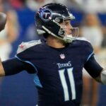 Tennessee Titans quarterback Mason Rudolph (11) draws back to pass Sunday, Dec. 22, 2024, during a game against the Indianapolis Colts at Lucas Oil Stadium in Indianapolis.