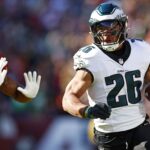 Dec 22, 2024; Landover, Maryland, USA; Philadelphia Eagles running back Saquon Barkley (26) runs the ball during the first quarter against the Washington Commanders at Northwest Stadium. Mandatory Credit: Peter Casey-Imagn Images