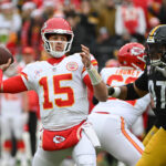 Dec 25, 2024; Pittsburgh, Pennsylvania, USA; Kansas City Chiefs quarterback Patrick Mahomes (15) throws a pass while being pressured by Pittsburgh Steelers defensive tackle Cameron Heyward (97) during the first quarter at Acrisure Stadium. Mandatory Credit: Barry Reeger-Imagn Images