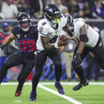 Dec 15, 2024; Houston, Texas, USA; Baltimore Ravens quarterback Lamar Jackson (8) runs with the ball during the second quarter against the Houston Texans at NRG Stadium. Mandatory Credit: Troy Taormina-Imagn Images