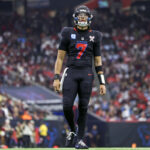 Dec 25, 2024; Houston, Texas, USA; Houston Texans quarterback C.J. Stroud (7) reacts after a play during the game against the Baltimore Ravens at NRG Stadium. Mandatory Credit: Troy Taormina-Imagn Images