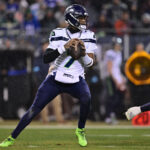 Dec 26, 2024; Chicago, Illinois, USA; Seattle Seahawks quarterback Geno Smith (7) looks to pass against the Seattle Seahawks during the third quarter at Soldier Field. Mandatory Credit: Daniel Bartel-Imagn Images