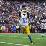 Dec 28, 2024; Foxborough, Massachusetts, USA; Los Angeles Chargers wide receiver Derius Davis (12) makes a catch to score a touchdown against the New England Patriots during the first half at Gillette Stadium. Mandatory Credit: Gregory Fisher-Imagn Images