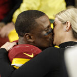 Dec 29, 2024; Landover, Maryland, USA; Washington Commanders safety Jeremy Reaves (39) proposes to his girlfriend Mikaela Worley after defeating the Atlanta Falcons in overtime at Northwest Stadium. Mandatory Credit: Amber Searls-Imagn Images