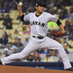 Mar 21, 2017; Los Angeles, CA, USA; Japan pitcher Tomoyuki Sugano (11) throws a pitch during the first inning against United States during the 2017 World Baseball Classic at Dodger Stadium. Mandatory Credit: Robert Hanashiro-USA TODAY Sports