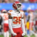 Kansas City Chiefs cornerback Jaylen Watson (35) celebrates after breaking up a pass for Los Angeles Chargers wide receiver Joshua Palmer (5) in the second half at SoFi Stadium.