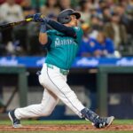 Seattle Mariners designated hitter Jorge Polanco (7) hits a two-run single during the fourth inning against the Oakland Athletics at T-Mobile Park.