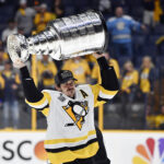 Jun 11, 2017; Nashville, TN, USA; Pittsburgh Penguins center Evgeni Malkin (71) hoists the Stanley Cup after defeating the Nashville Predators in game six of the 2017 Stanley Cup Final at Bridgestone Arena. Mandatory Credit: Christopher Hanewinckel-USA TODAY Sports