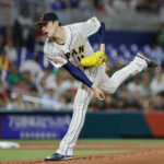 Mar 20, 2023; Miami, Florida, USA; Japan starting pitcher Roki Sasaki (14) delivers a pitch during the first inning against Mexico at LoanDepot Park.