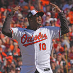 Oct 7, 2023; Baltimore, Maryland, USA; Former Baltimore Orioles outfielder Adam Jones reacts after throwing out the ceremonial first pitch prior to the game against the Texas Rangers during game one of the ALDS for the 2023 MLB playoffs at Oriole Park at Camden Yards. Mandatory Credit: Mitch Stringer-USA TODAY Sports