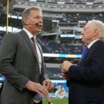 Oct 16, 2023; Inglewood, California, USA; Dallas Cowboys owner Jerry Jones (right) talks with former quarterback Troy Aikman before the game against the Los Angeles Chargers at SoFi Stadium. Mandatory Credit: Kirby Lee-USA TODAY Sports