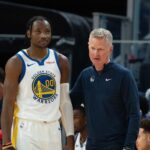 Warriors NBA Mercado Kuminga October 20, 2023; San Francisco, California, USA; Golden State Warriors head coach Steve Kerr (right) talks to forward Jonathan Kuminga (00) during the third quarter against the San Antonio Spurs at Chase Center. Mandatory Credit: Kyle Terada-Imagn Images