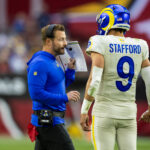 Nov 26, 2023; Glendale, Arizona, USA; Los Angeles Rams head coach Sean McVay talks with quarterback Matthew Stafford (9) against the Arizona Cardinals at State Farm Stadium. Mandatory Credit: Mark J. Rebilas-USA TODAY Sports
