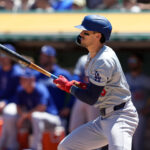 Aug 4, 2024; Oakland, California, USA; Los Angeles Dodgers first baseman Cavan Biggio (6) hits an RBI single against the Oakland Athletics during the third inning at Oakland-Alameda County Coliseum. Mandatory Credit: Darren Yamashita-USA TODAY Sports