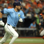 Aug 11, 2024; St. Petersburg, Florida, USA; Tampa Bay Rays outfielder Dylan Carlson (10) hits an RBI double against the Baltimore Orioles during the seventh inning at Tropicana Field. Mandatory Credit: Kim Klement Neitzel-USA TODAY Sports