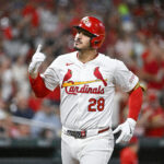 Sep 11, 2024; St. Louis, Missouri, USA; St. Louis Cardinals third baseman Nolan Arenado (28) reacts after hitting a solo home run against the Cincinnati Reds during the fourth inning at Busch Stadium. Mandatory Credit: Jeff Curry-Imagn Images
