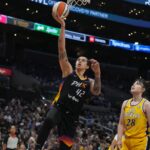 Sep 17, 2024; Los Angeles, California, USA; Phoenix Mercury center Brittney Griner (42) shoots the ball against LA Sparks center Li Yueru (28) in the first half at Crypto.com Arena.