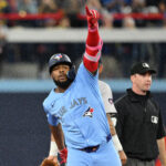Sep 24, 2024; Toronto, Ontario, CAN; Toronto Blue Jays designated hitter Vladimir Guerrero Jr. (27) reacts after hitting a two run RBI double against the Boston Red Sox in the third inning at Rogers Centre. Mandatory Credit: Dan Hamilton-Imagn Images