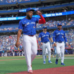 Sep 29, 2024; Toronto, Ontario, CAN; Toronto Blue Jays designated hitter Vladimir Guerrero Jr. (27) walks back to the dugout before the start of a game against the Miami Marlins at Rogers Centre. Mandatory Credit: Nick Turchiaro-Imagn Images