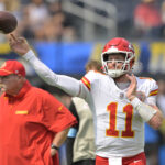 Sep 29, 2024; Inglewood, California, USA; Kansas City Chiefs quarterback Carson Wentz (11) warms up prior to the game against the Los Angeles Chargers at SoFi Stadium. Mandatory Credit: Jayne Kamin-Oncea-Imagn Images
