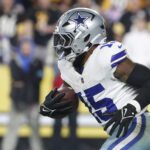 Oct 6, 2024; Pittsburgh, Pennsylvania, USA; Dallas Cowboys running back Ezekiel Elliott (15) runs the ball against the Pittsburgh Steelers during the fourth quarter at Acrisure Stadium. Dallas won 20-17. Mandatory Credit: Charles LeClaire-Imagn Images