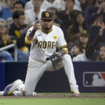 Oct 8, 2024; San Diego, California, USA; San Diego Padres first baseman Luis Arraez (4) reacts after an out in the sixth inning against the Los Angeles Dodgers during game three of the NLDS for the 2024 MLB Playoffs at Petco Park. Mandatory Credit: David Frerker-Imagn Images - Yankees