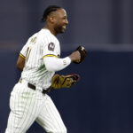 San Diego Padres outfielder Jurickson Profar (10) reacts after making a catch in the first inning against the Los Angeles Dodgers during game four of the NLDS for the 2024 MLB Playoffs at Petco Park.
