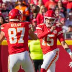 Nov 10, 2024; Kansas City, Missouri, USA; Kansas City Chiefs quarterback Patrick Mahomes (15) throws to tight end Travis Kelce (87) against the Denver Broncos during the first half at GEHA Field at Arrowhead Stadium. Mandatory Credit: Denny Medley-Imagn Images