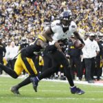 Nov 17, 2024; Pittsburgh, Pennsylvania, USA; Pittsburgh Steelers cornerback Joey Porter Jr. (24) stops Baltimore Ravens quarterback Lamar Jackson (8) short of the end-zone on a two point conversion attempt during the fourth quarter at Acrisure Stadium.