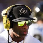 Colorado Buffaloes head coach Deion Sanders walks the sidelines as his team takes on the ASU Sun Devils at Mountain America Stadium in Tempe on Oct. 7, 2023.