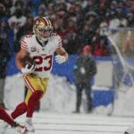 49ers Christian McCaffrey carries the ball for several yards during first half action of their home game against the San Francisco 49ers in Orchard Park on Dec. 1, 2024.