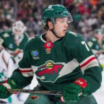 Dec 12, 2024; Saint Paul, Minnesota, USA; Minnesota Wild defenseman Brock Faber (7) skates after the puck against the Edmonton Oilers in the first period at Xcel Energy Center. Mandatory Credit: Brad Rempel-Imagn Images