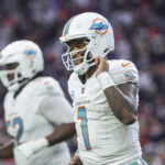 Dec 15, 2024; Houston, Texas, USA; Miami Dolphins quarterback Tua Tagovailoa (1) jogs off the field after a play during the fourth quarter against the Houston Texans at NRG Stadium.