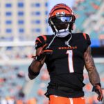 Dec 22, 2024; Cincinnati, Ohio, USA; Cincinnati Bengals wide receiver Ja'Marr Chase (1) acknowledges fans during warmups before the game against the Cleveland Browns at Paycor Stadium. Mandatory Credit: Katie Stratman-Imagn Images