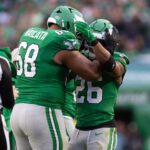 Dec 29, 2024; Philadelphia, Pennsylvania, USA; Philadelphia Eagles running back Saquon Barkley (26) celebrates with offensive tackle Jordan Mailata (68) after rushing for 167 yards in a game against the Dallas Cowboys at Lincoln Financial Field. Mandatory Credit: Bill Streicher-Imagn Images