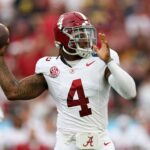 Dec 31, 2024; Tampa, FL, USA; Alabama Crimson Tide quarterback Jalen Milroe (4) drops back to pass against the Michigan Wolverines in the first quarter during the ReliaQuest Bowl at Raymond James Stadium. Mandatory Credit: Nathan Ray Seebeck-Imagn Images