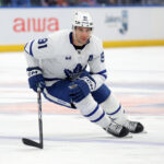 Jan 2, 2025; Elmont, New York, USA; Toronto Maple Leafs center John Tavares (91) skates against the New York Islanders during the third period at UBS Arena. Mandatory Credit: Brad Penner-Imagn Images