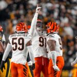 Cincinnati Bengals defensive end Trey Hendrickson (91) celebrates after sacking Pittsburgh Steelers quarterback Russell Wilson (3) in the first quarter of the NFL Week 18 game between the Pittsburgh Steelers and the Cincinnati Bengals at Acrisure Stadium in Pittsburgh on Saturday, Jan. 4, 2025.