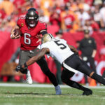 Jan 5, 2025; Tampa, Florida, USA; Tampa Bay Buccaneers quarterback Baker Mayfield (6) runs with the ball against the New Orleans Saints in the second quarter at Raymond James Stadium. Mandatory Credit: Nathan Ray Seebeck-Imagn Images