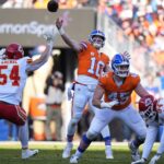 Jan 5, 2025; Denver, Colorado, USA; Denver Broncos quarterback Bo Nix (10) passes the ball in the first quarter against the Kansas City Chiefs at Empower Field at Mile High. Mandatory Credit: Ron Chenoy-Imagn Images