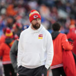 Jan 5, 2025; Denver, Colorado, USA; Kansas City Chiefs tight end Travis Kelce (87) walks the sidelines in the second half against the Denver Broncos at Empower Field at Mile High. Mandatory Credit: Ron Chenoy-Imagn Images