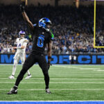 Jan 5, 2025; Detroit, Michigan, USA; Detroit Lions cornerback Terrion Arnold (0) celebrates after breaking up a fourth down pass by Minnesota Vikings quarterback Sam Darnold (14) in the end zone in the third quarter at Ford Field. The pass was incomplete.Mandatory Credit: Lon Horwedel-Imagn Images