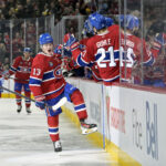 Jan 6, 2025; Montreal, Quebec, CAN; Montreal Canadiens forward Cole Caufield (13) celebrates with teammates after scoring a goal against the Vancouver Canucks during the first period at the Bell Centre. Mandatory Credit: Eric Bolte-Imagn Images