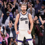 Jan 6, 2025; Sacramento, California, USA; Sacramento Kings forward Domantas Sabonis (11) reacts after making a three point shot against the Miami Heat during overtime at Golden 1 Center. Mandatory Credit: Ed Szczepanski-Imagn Images