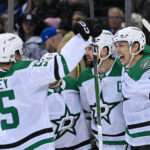 Jan 7, 2025; New York, New York, USA; Dallas Stars left wing Jason Robertson (21) and Dallas Stars defenseman Thomas Harley (55) celebrate the game winning goal against the New York Rangers by Dallas Stars left wing Jamie Benn (14) during the overtime period at Madison Square Garden. Mandatory Credit: Dennis Schneidler-Imagn Images