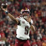 Jan 12, 2025; Tampa, Florida, USA; Washington Commanders quarterback Jayden Daniels (5) throws during the second quarter of a NFC wild card playoff against the Tampa Bay Buccaneers at Raymond James Stadium.