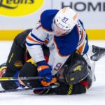 Jan 18, 2025; Vancouver, British Columbia, CAN; Edmonton Oilers forward Connor McDavid (97) battles with Vancouver Canucks forward Conor Garland (8) in the third period at Rogers Arena. Mandatory Credit: Bob Frid-Imagn Images