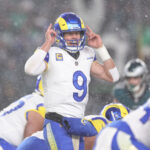 Jan 19, 2025; Philadelphia, Pennsylvania, USA; Los Angeles Rams quarterback Matthew Stafford (9) calls a play from the line of scrimmage in the third quarter against the Philadelphia Eagles in a 2025 NFC divisional round game at Lincoln Financial Field. Mandatory Credit: Bill Streicher-Imagn Images